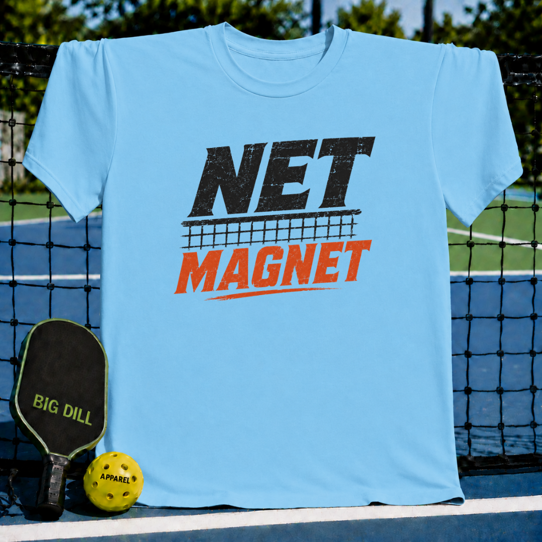 Vibrant teal unisex t-shirt featuring a distressed black and red Net Magnet graphic on a pickleball court background.