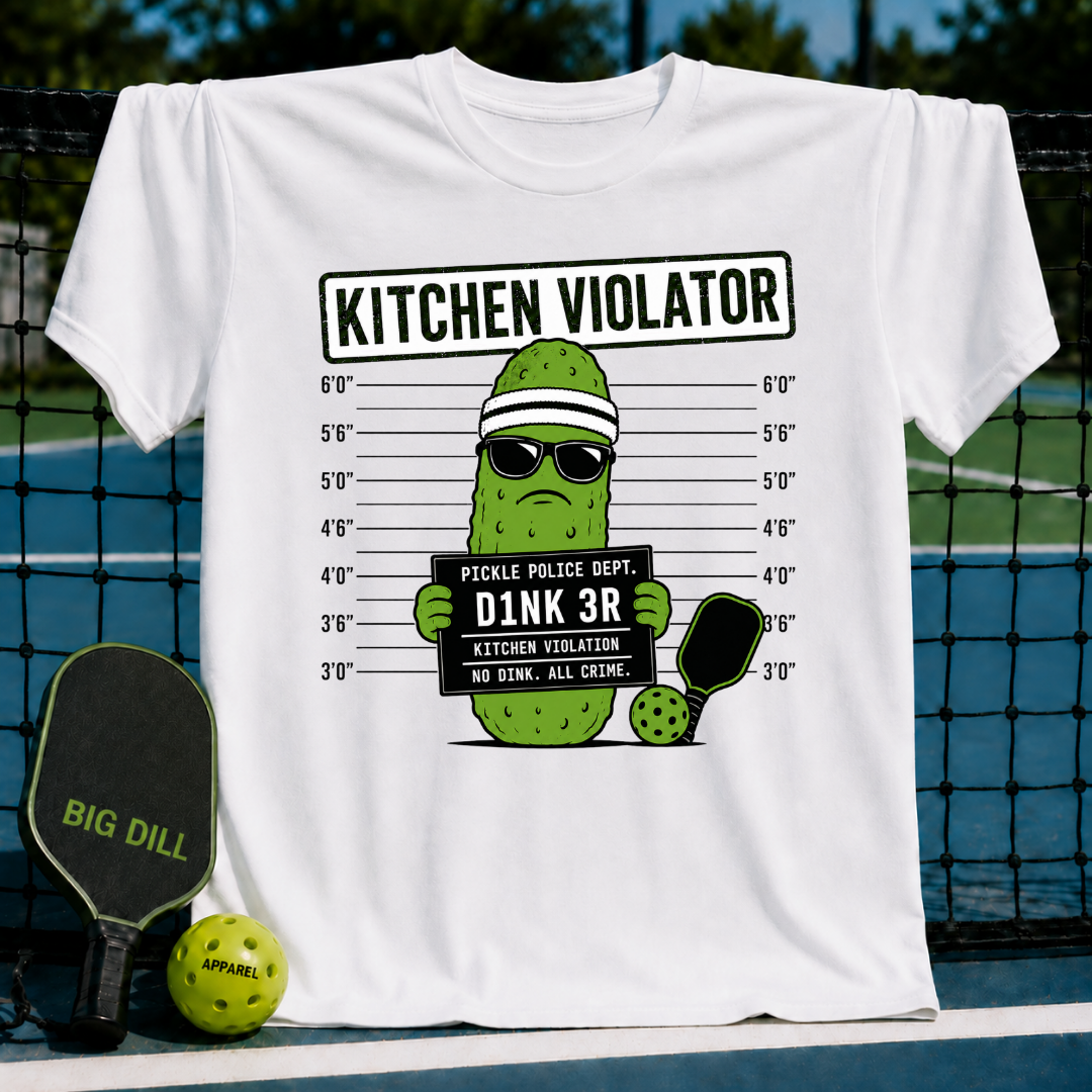 White crew neck t-shirt featuring a pickle character in sunglasses and a headband posing for a mug shot with a pickleball paddle.