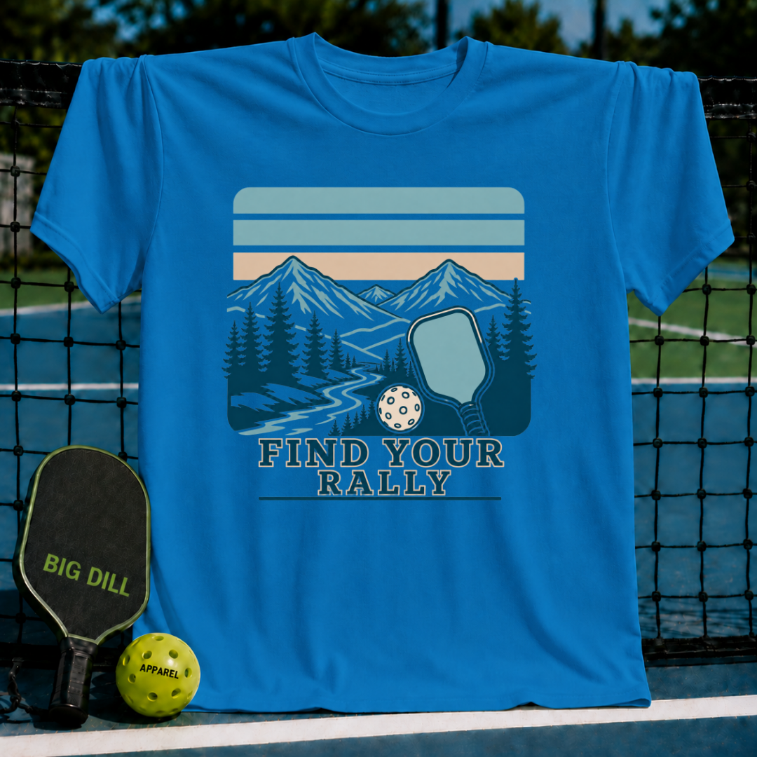 Bright blue crew neck t-shirt featuring a retro mountain and pickleball graphic with the text Find Your Rally.