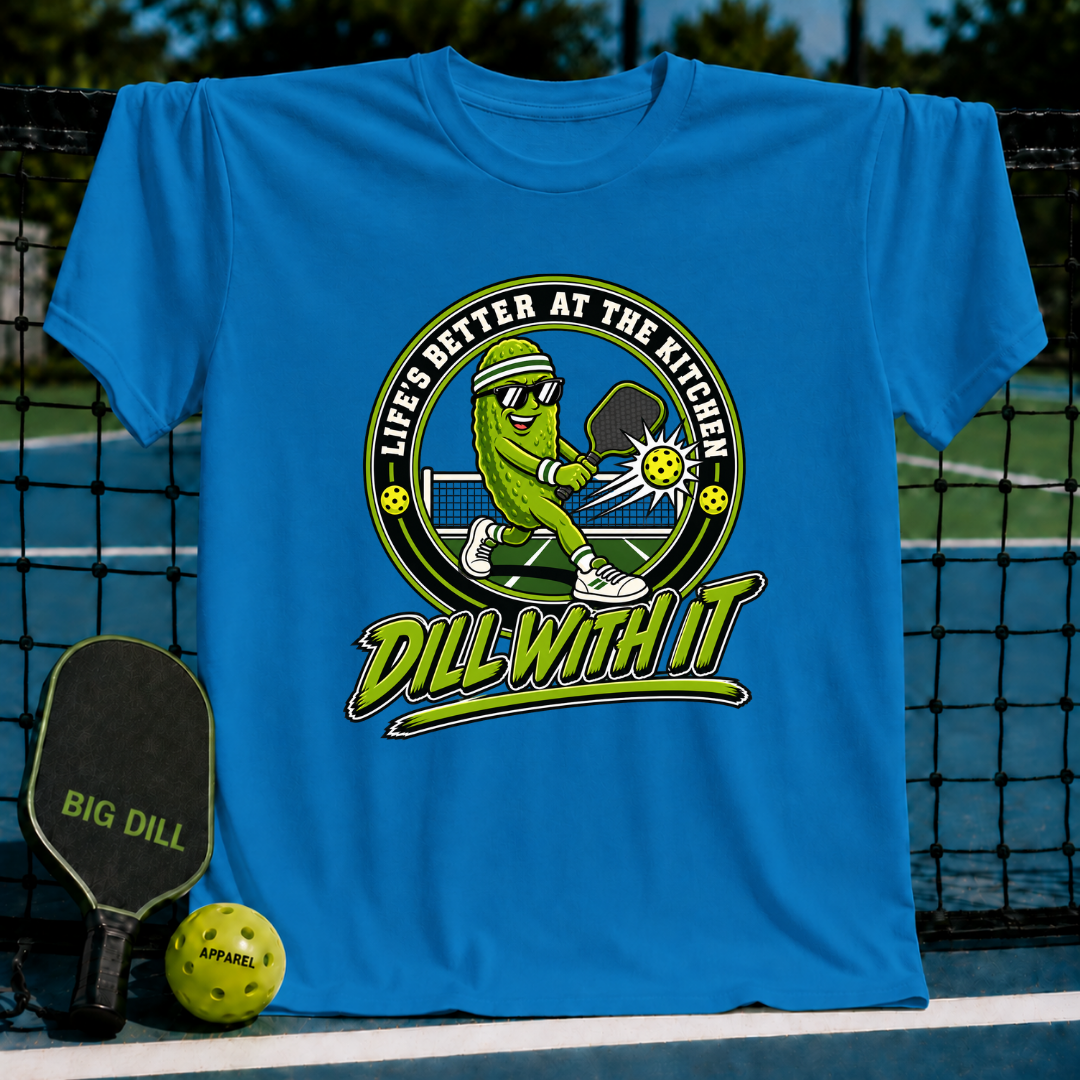Bright blue crew neck t-shirt featuring a cartoon pickle playing pickleball with the text Dill With It.