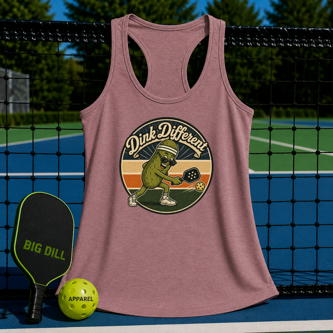 Mauve racerback tank top featuring a retro pickleball graphic, displayed on a pickleball court with paddle and ball.
