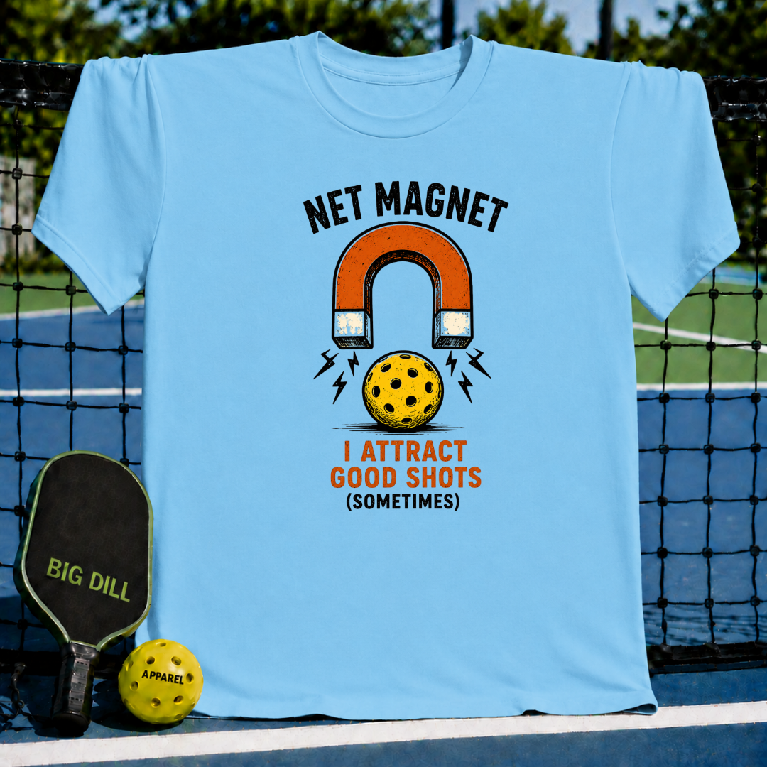 Light blue unisex t-shirt featuring a vintage horseshoe magnet and pickleball graphic with the text Net Magnet I Attract Good Shots.
