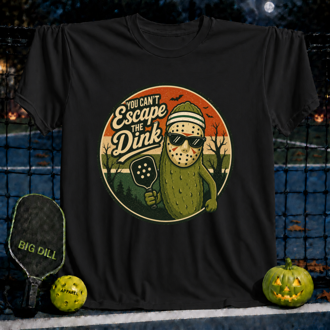 Black unisex t-shirt featuring a pickleball-playing pickle wearing a hockey mask and sunglasses with the text You Can't Escape the Dink.