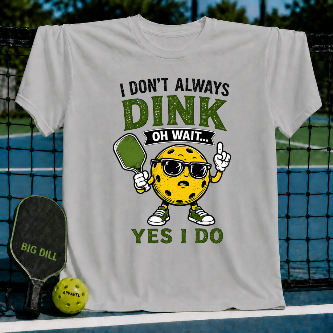 Light gray crew neck t-shirt featuring a cartoon pickleball character with sunglasses, holding a paddle, and funny text.