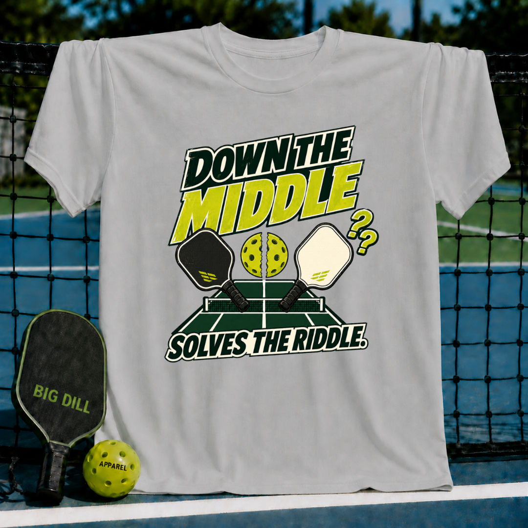 Light gray crewneck t-shirt featuring a pickleball court graphic with paddles, a split ball, and Down the Middle text.