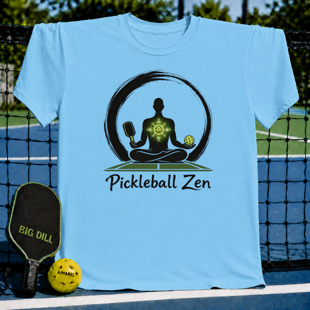 Light blue crewneck t-shirt featuring a Zen-inspired graphic of a meditating player with a pickleball paddle and ball.