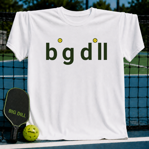 White unisex t-shirt featuring Big Dill text with yellow pickleball dots, displayed on a pickleball court with a paddle.