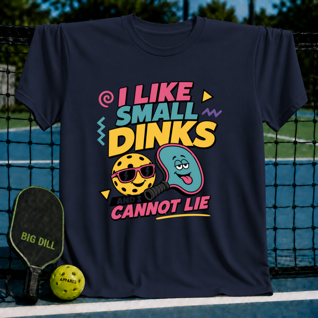 Navy blue crewneck t-shirt featuring a colorful pickleball graphic with sunglasses and a silly face, set against a court background.