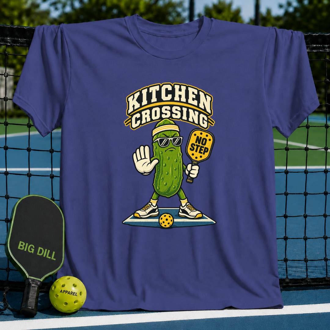 Purple cotton T-shirt featuring a cartoon pickle wearing sunglasses and holding a No Step pickleball paddle.