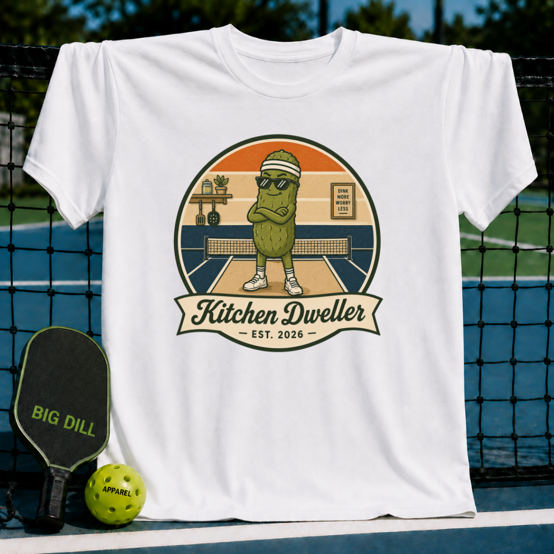 White unisex t-shirt featuring a retro pickleball graphic of a pickle character with sunglasses on a court.
