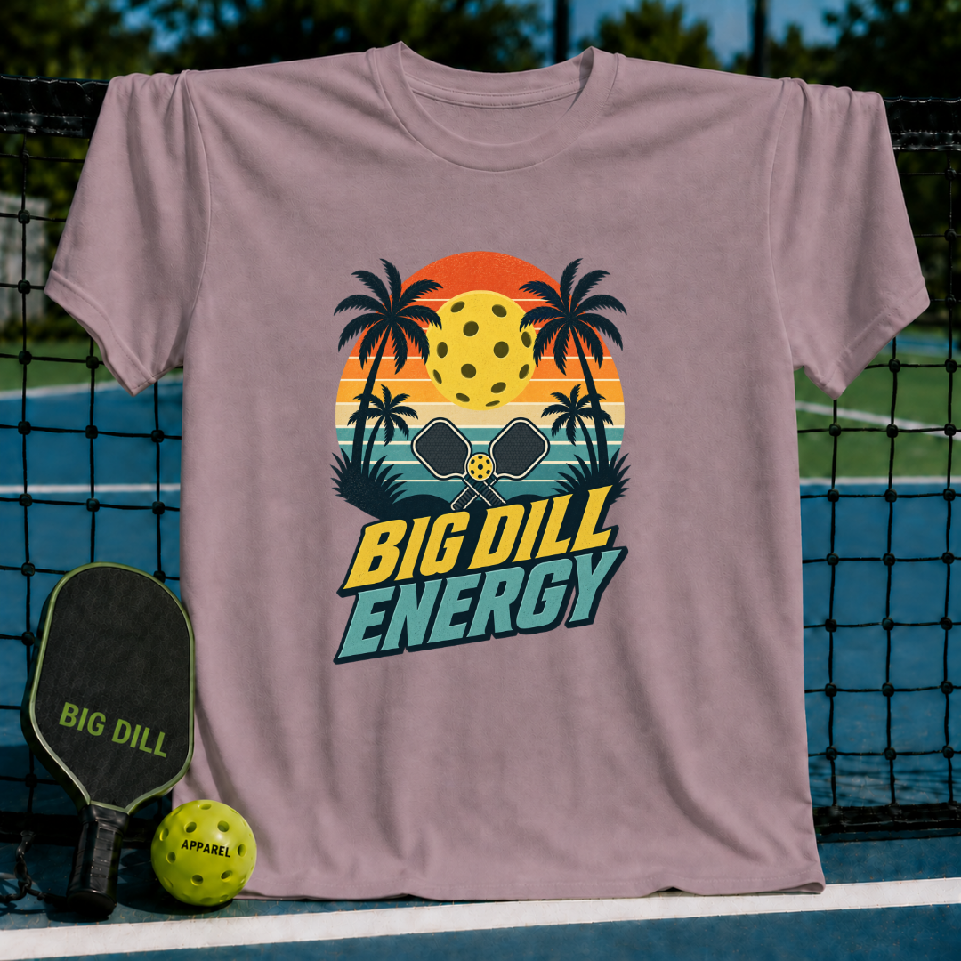 Mauve crewneck t-shirt featuring a retro sunset, palm trees, and pickleball graphic with Big Dill Energy text.