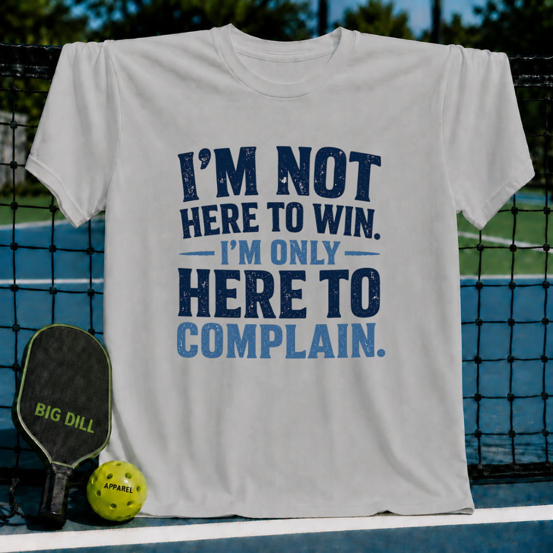 White unisex t-shirt featuring distressed navy and blue text that reads I'm Not Here To Win, I'm Only Here To Complain.