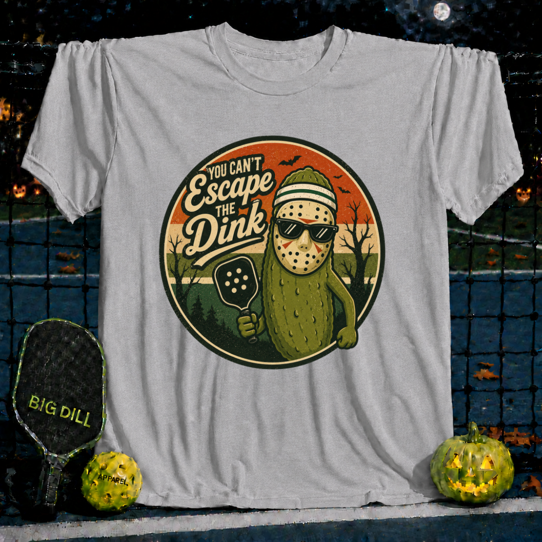 Sport grey unisex t-shirt featuring a pickleball-playing pickle wearing a hockey mask and sunglasses with retro Halloween art.