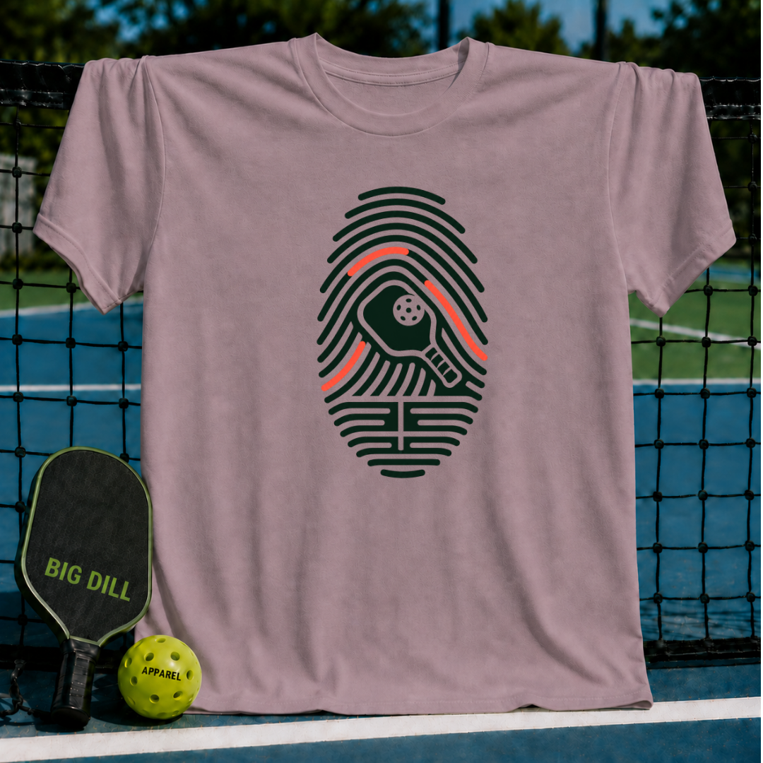 Mauve crew neck t-shirt featuring a dark green fingerprint graphic with a pickleball paddle and ball design.