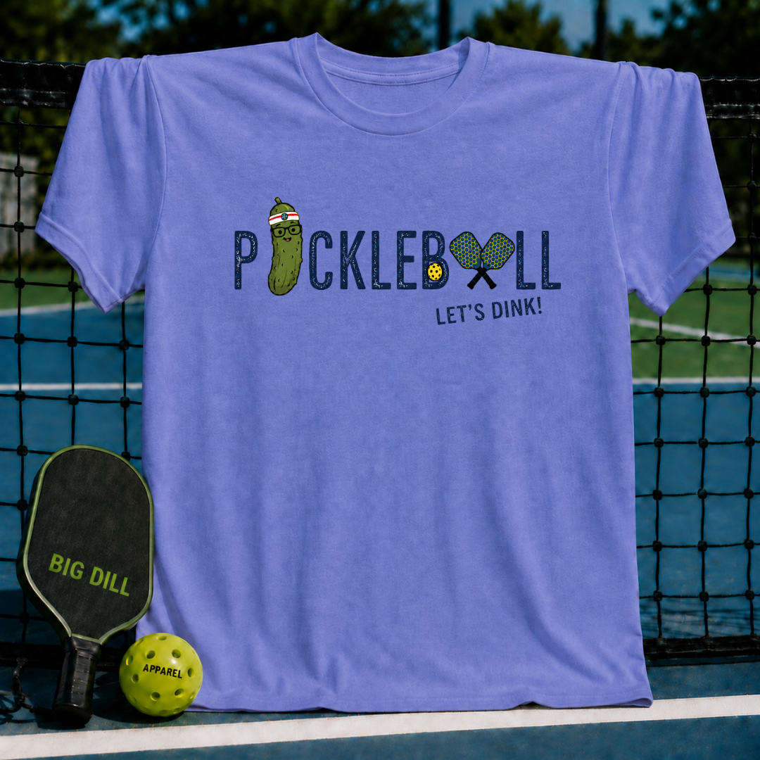 Periwinkle blue crewneck t-shirt featuring a pickleball graphic with a cute pickle character and the text Let's Dink.