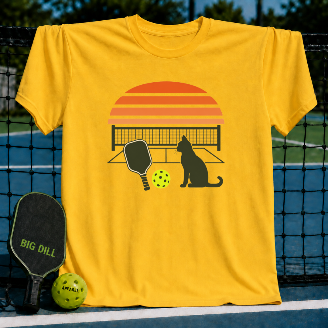 Daisy yellow unisex t-shirt featuring a retro sunset, cat silhouette, pickleball paddle, and ball graphic.