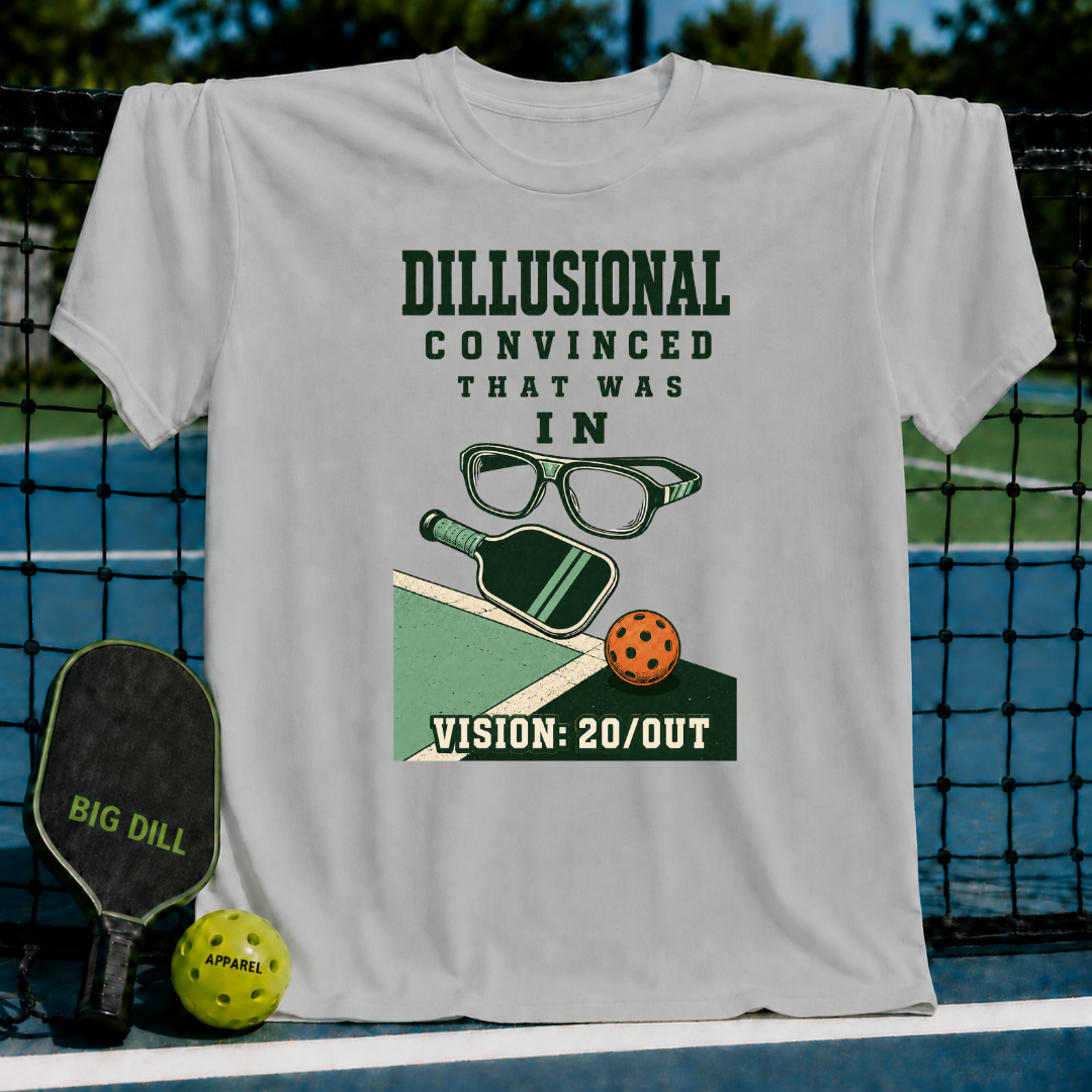 Light gray Vision 20_OUT pickleball t-shirt featuring a humorous graphic of glasses, a paddle, and a ball on a court.