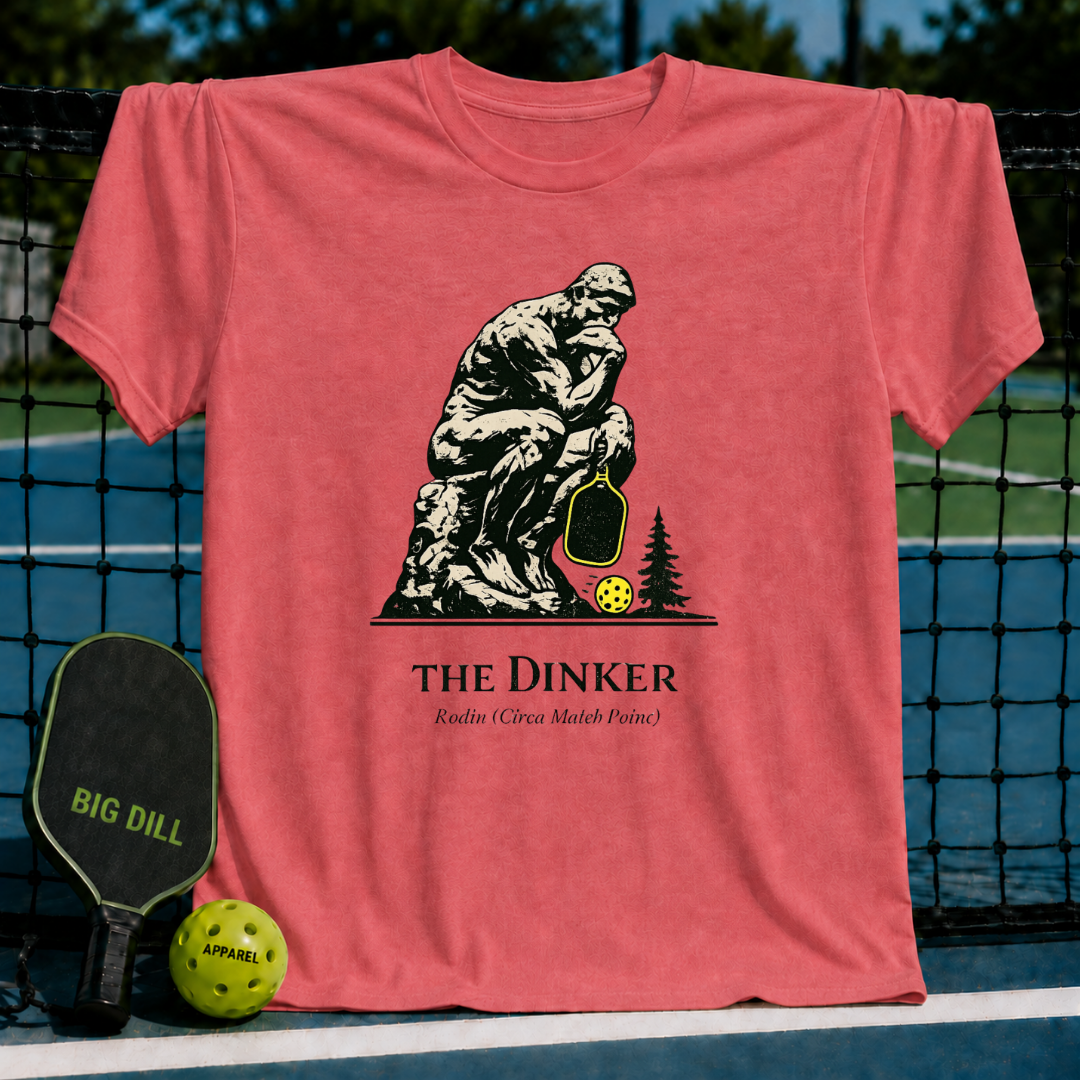 Coral pink unisex t-shirt featuring a graphic of The Thinker holding a pickleball paddle next to a neon yellow ball.