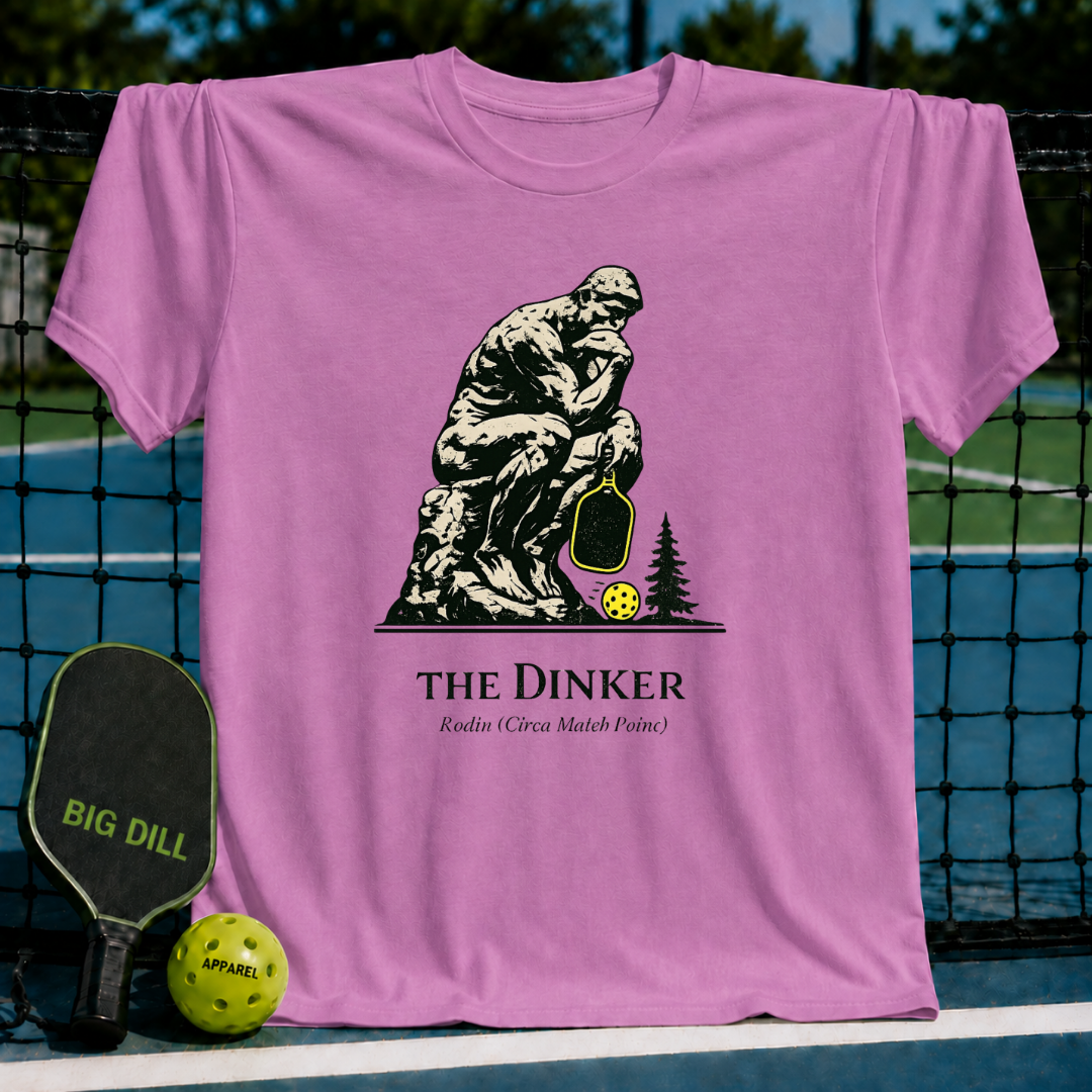 Periwinkle blue unisex t-shirt featuring The Thinker holding a pickleball paddle and neon yellow ball graphic.