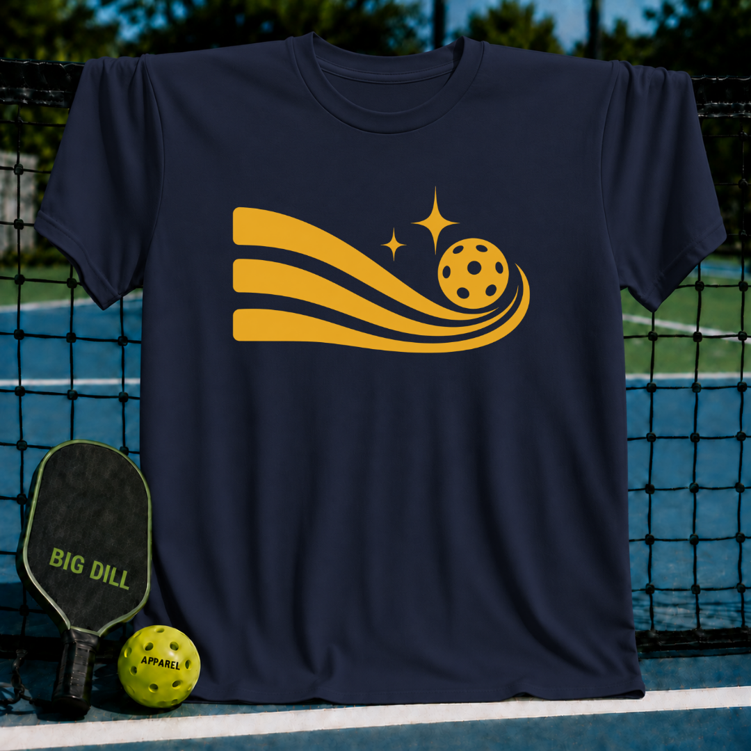 Navy blue unisex t-shirt featuring a yellow graphic of a pickleball trailing motion lines and stars on a pickleball court.