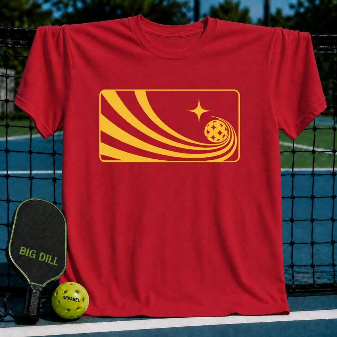 Red unisex Solar Flow T-shirt featuring a yellow minimalist pickleball graphic with comet-like motion lines on a court.