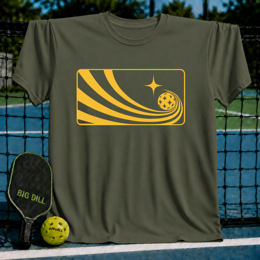 Olive green unisex Solar Flow T-shirt featuring a yellow graphic of a pickleball with a comet-like motion trail.