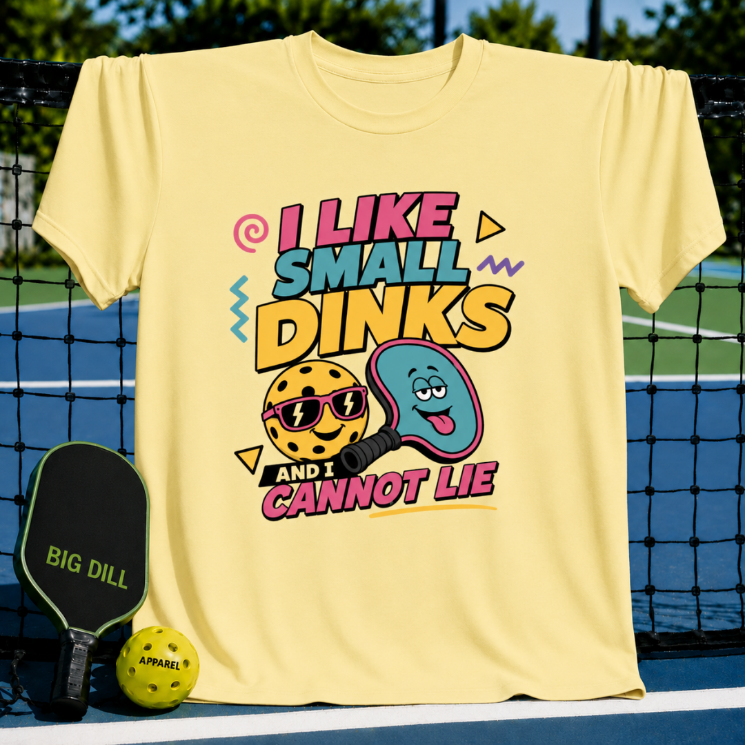 Light yellow cotton t-shirt featuring a colorful pickleball graphic with the text I Like Small Dinks and I Cannot Lie.