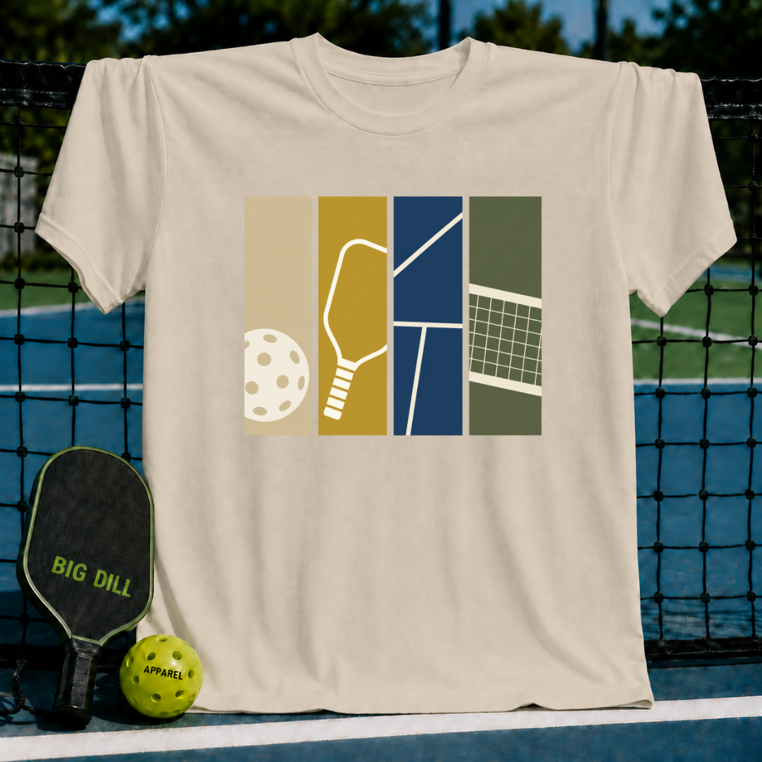 Beige Swatches T-shirt featuring a colorful graphic of a pickleball, paddle, court lines, and net on a pickleball court.