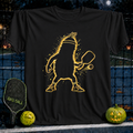 Black cotton t-shirt featuring a glowing yellow pickleball player graphic with a paddle and ball on a pickleball court background.