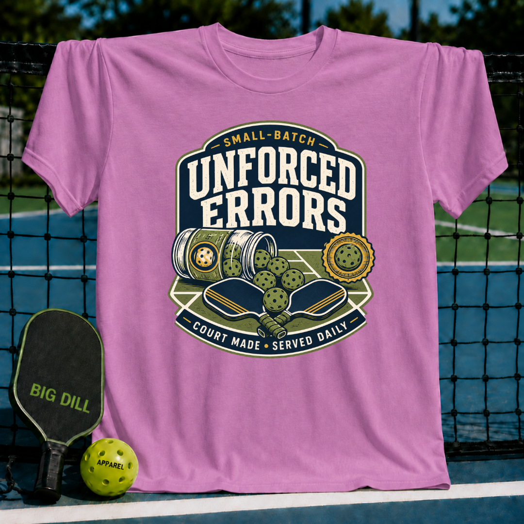Pink cotton t-shirt featuring a vintage-style pickleball graphic with paddles, balls, and Unforced Errors text.