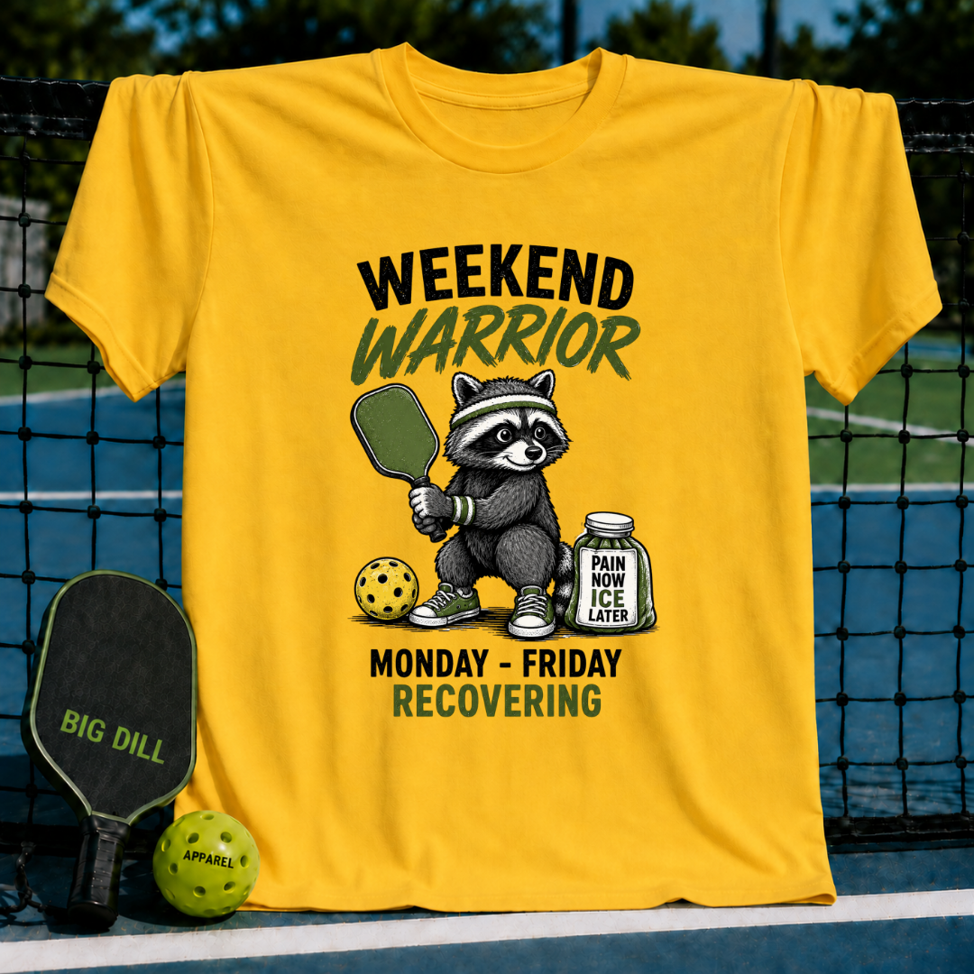 Bright yellow unisex t-shirt featuring a raccoon pickleball player graphic with text and a jar labeled Pain Now, Ice Later.
